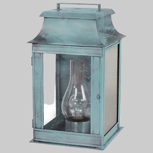 Vintage-style metal lantern with glass cover on a white background