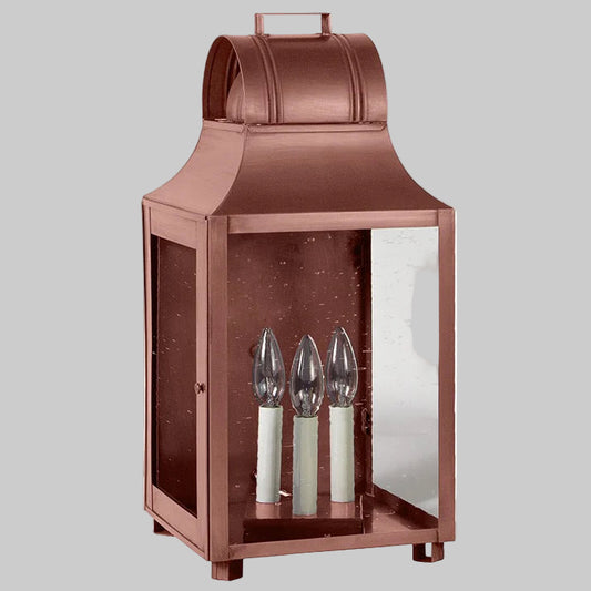Copper lantern with glass panels on a white background