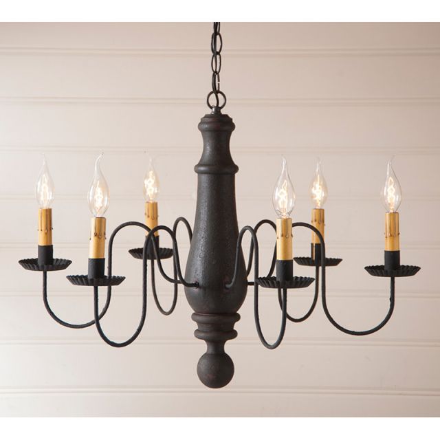 Black chandelier with six candle-style lights on a beige background