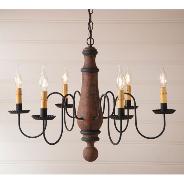 Wooden chandelier with six candle-style lights on a beige background