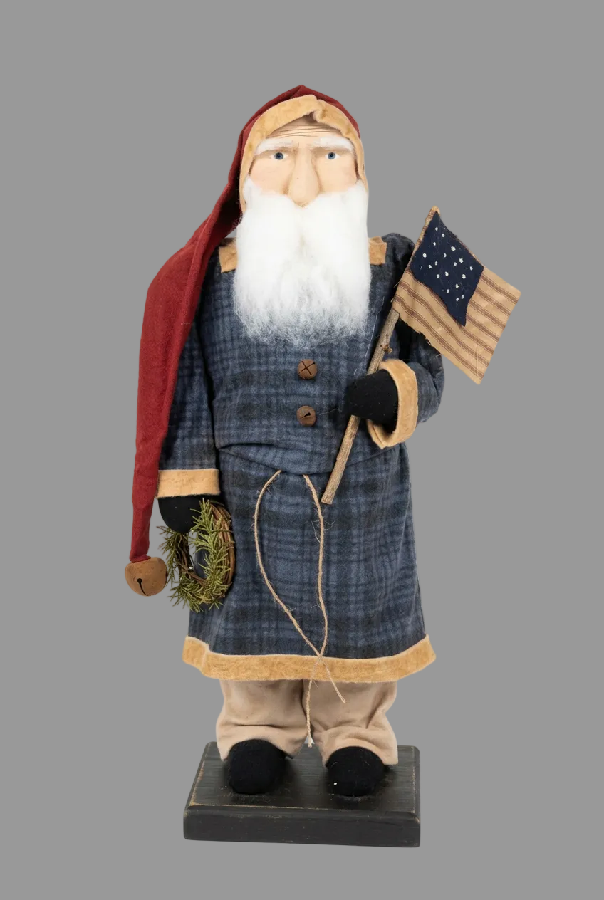 Primitive belsnickel with flag and wreath on gray background.