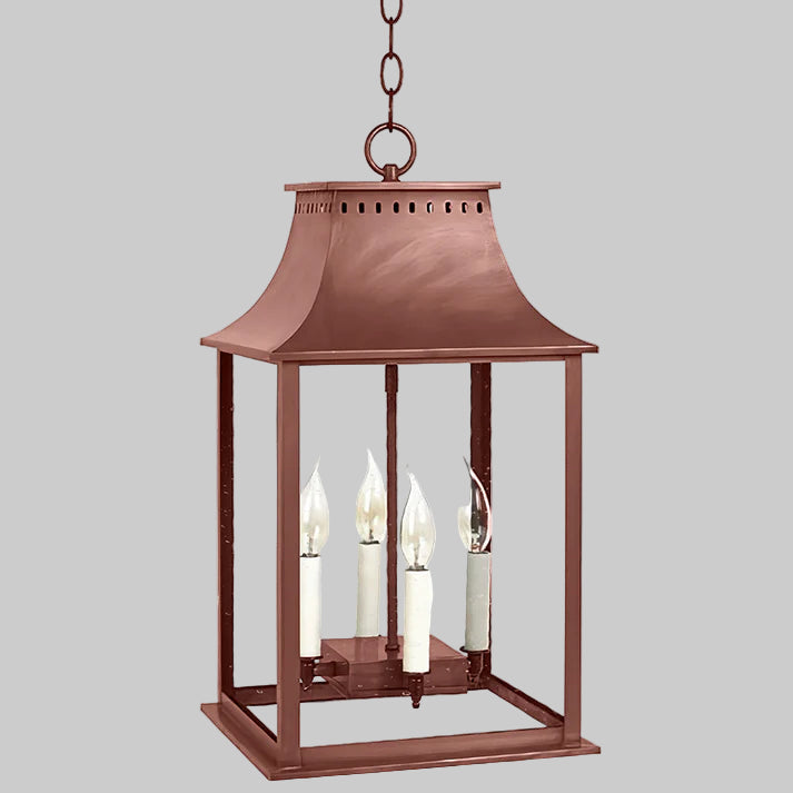 Copper lantern with glass panels on a white background