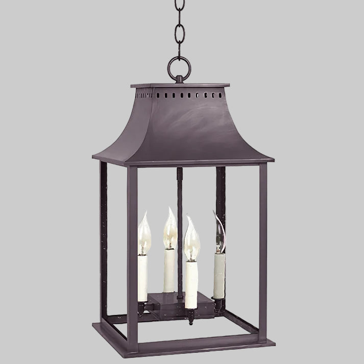 Decorative hanging lantern with three candle-like lights on a white background