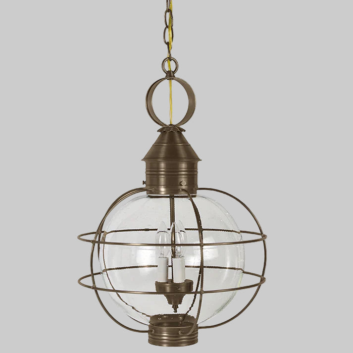 Bronze pendant light with glass cage on a white background