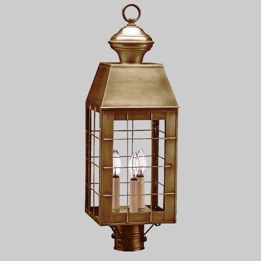 Bronze outdoor lantern with glass panels on a white background