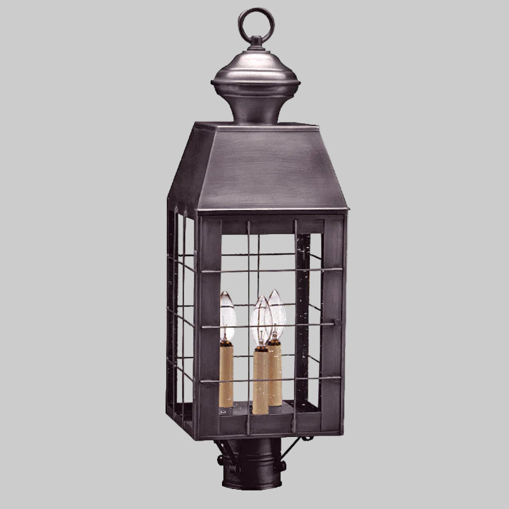 Decorative outdoor lantern with metal cage on a white background
