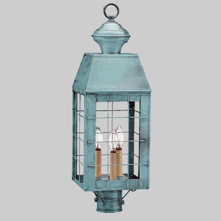 Vintage-style lantern with a metallic finish on a white background