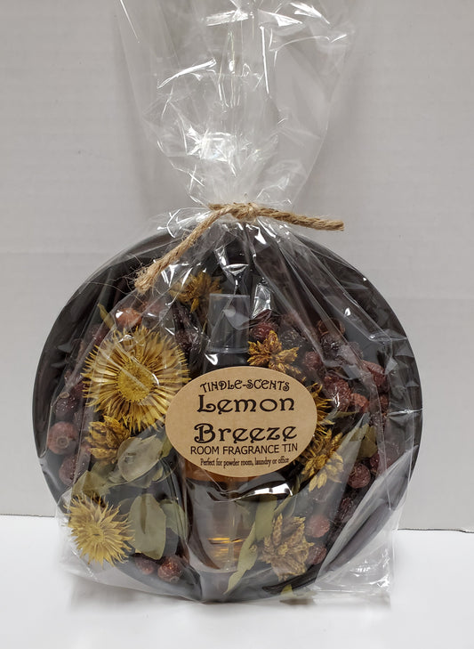 Metal pan with potpourri and scented oil in packaging labeled "Lemon Breeze"