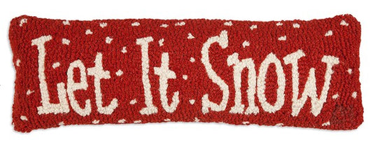 Regtangular pillow with red background and the words "Let It Snow" surrounded by snowflakes
