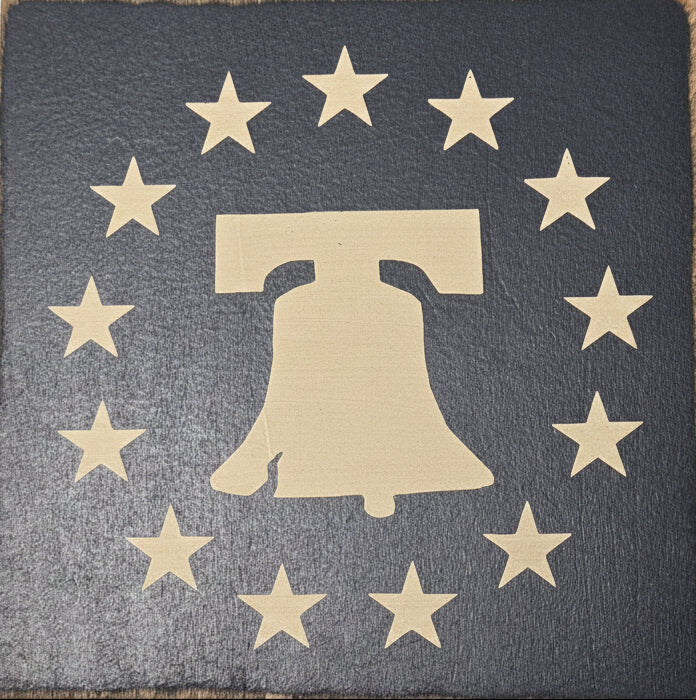 Gold Liberty Bell design on a dark blue background with stars