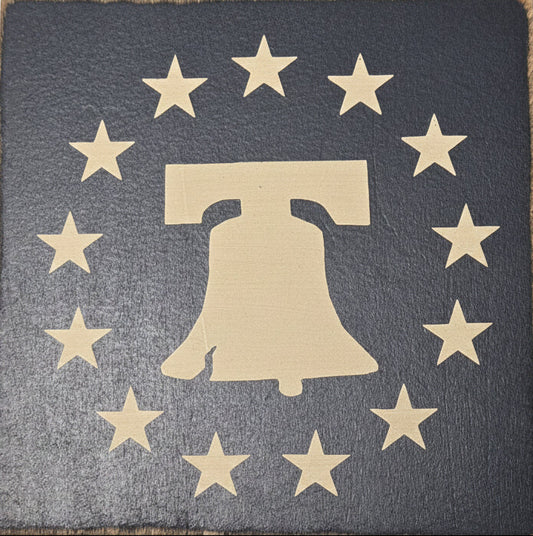 Gold Liberty Bell design on a dark blue background with stars