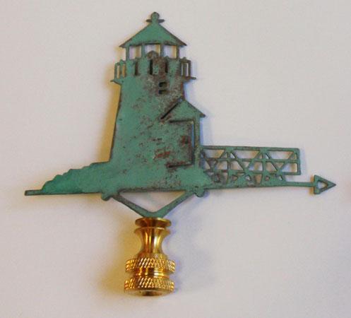 A bronze-colored copper lighthouse lamp finial with a verdigris finish, featuring a lighthouse design.