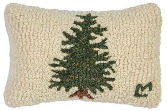 Rectangular cream color hooked pillow with a green pine tree in the center
