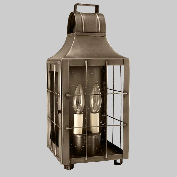 Bronze lantern with glass panels on a white background