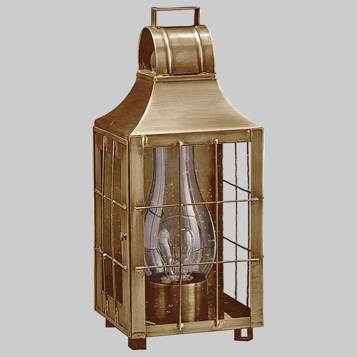 Bronze lantern with glass insert on a white background