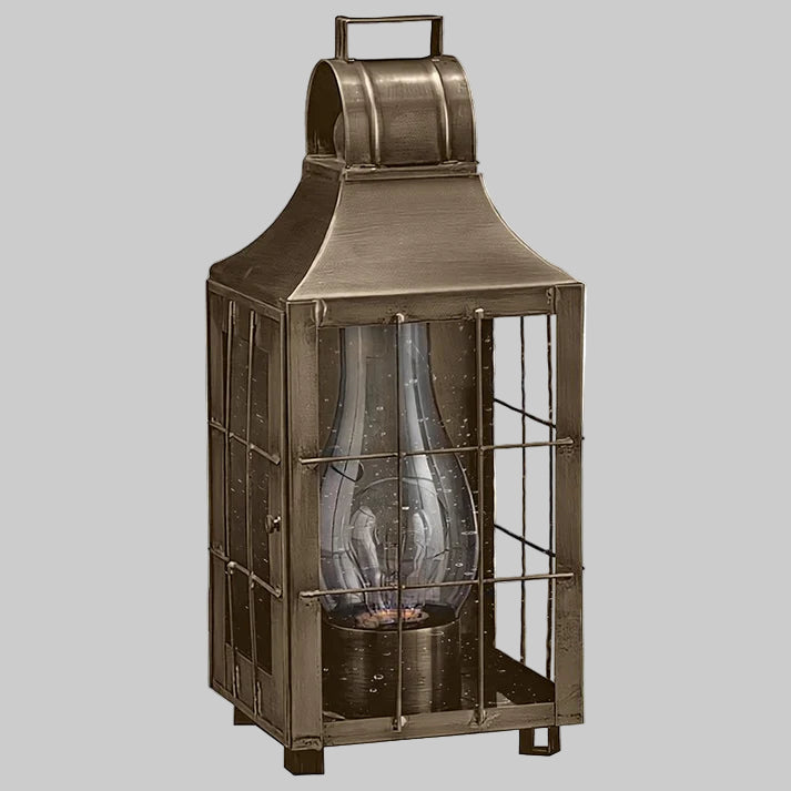 Bronze lantern with glass insert on a white background