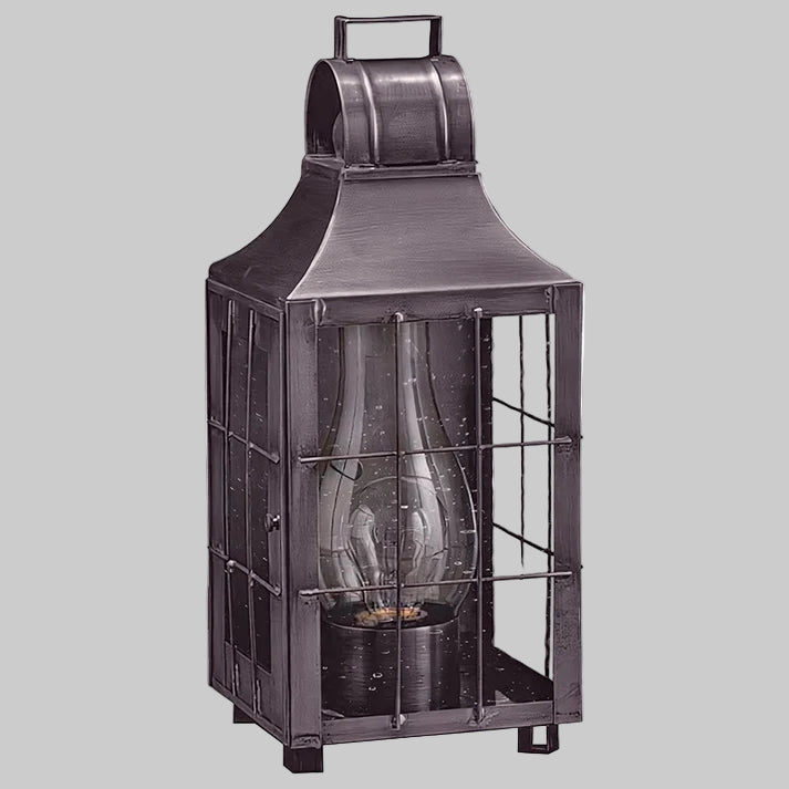 Metallic lantern with glass insert on a white background