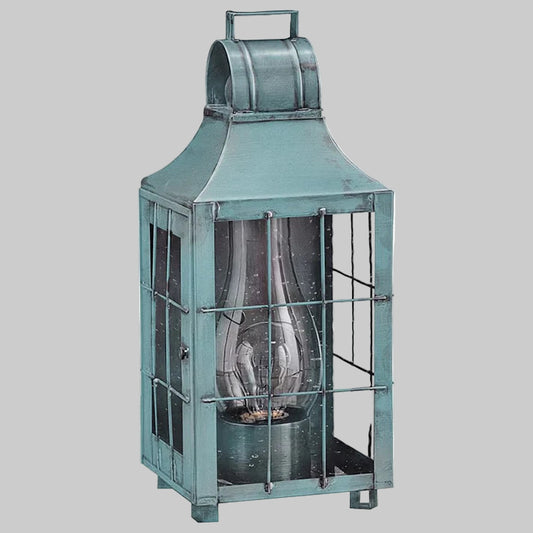 Teal metal lantern with glass panels on a white background