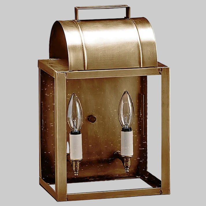 Brass outdoor wall light fixture with two clear glass panels and visible bulbs.