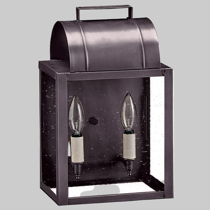 Decorative outdoor light fixture with two clear bulbs on a gray background