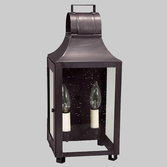Decorative lantern with two candle holders on a gray background