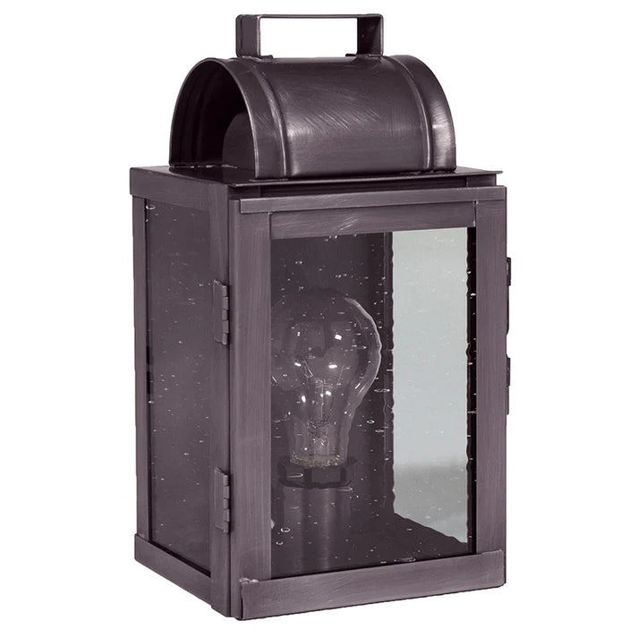 Dark metal lantern with a clear glass front on a white background