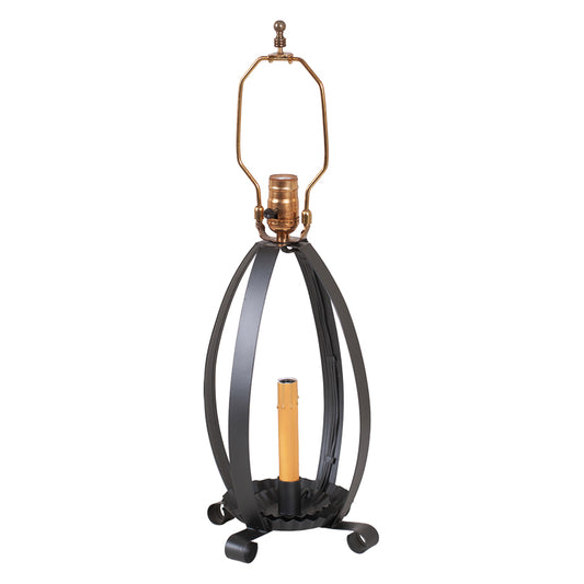 Decorative lamp with black metal base and gold accents on a white background