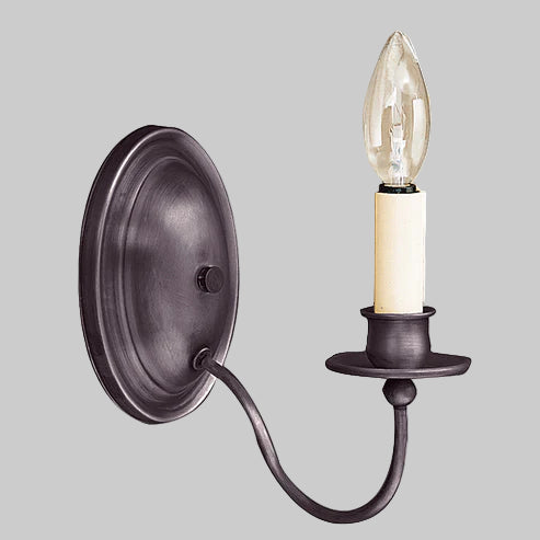 Wall-mounted light fixture with a single candle-style bulb on a gray background