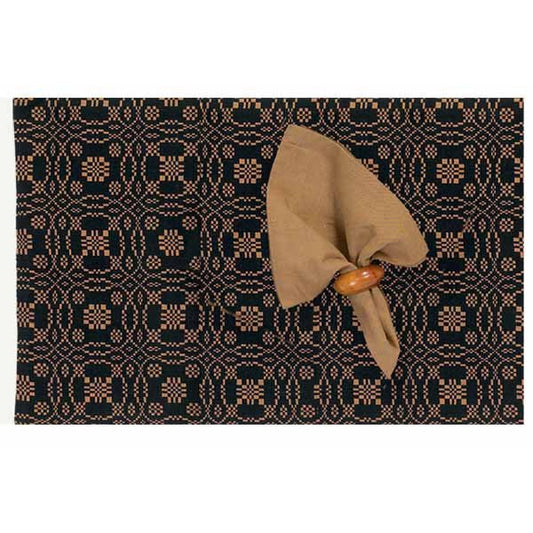 A rectangular placemat with an intricate geometric lover's knot jacquard design in a dark color, featuring a decorative bow on the corner.