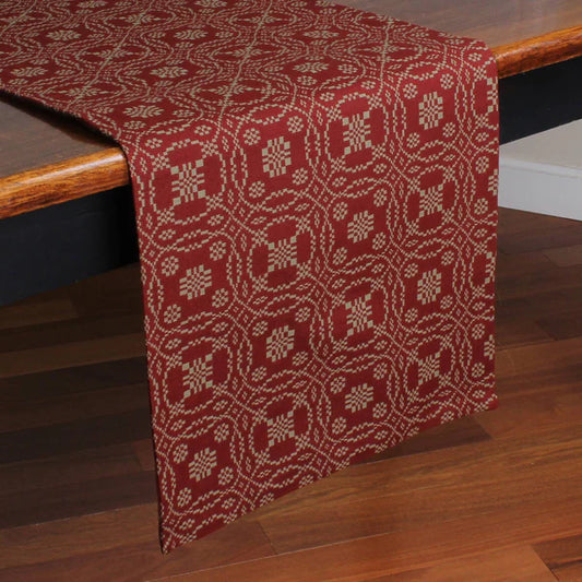 Lover's knot barn red table runner on wooden table