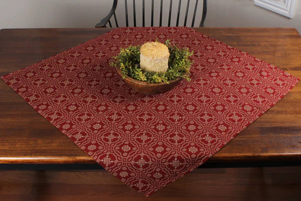 Lover's knot barn red table square on wooden table with candle