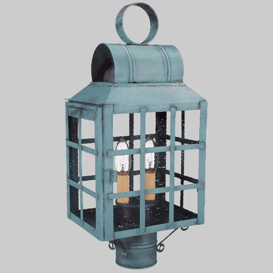 Teal outdoor lantern with glass panels on a gray background