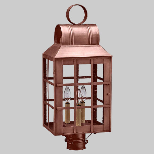 Copper lantern with glass panels on a gray background