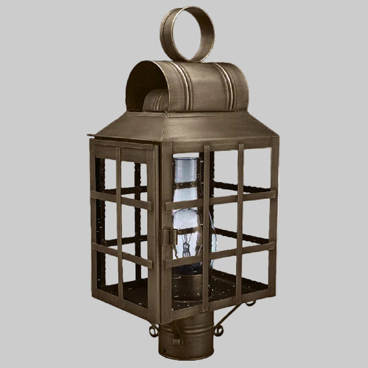 Bronze outdoor lantern with clear glass on a gray background