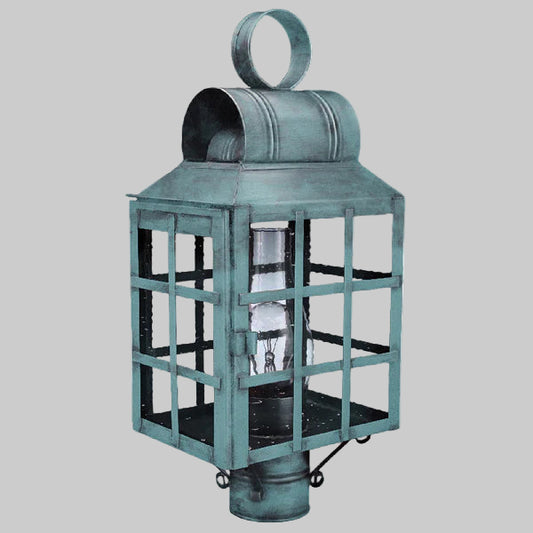 Vintage-style teal lantern with glass panels on a gray background