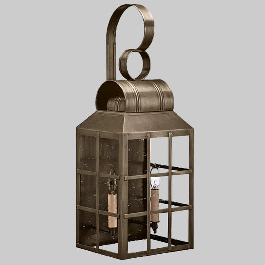 Decorative metal lantern with glass panels on a gray background