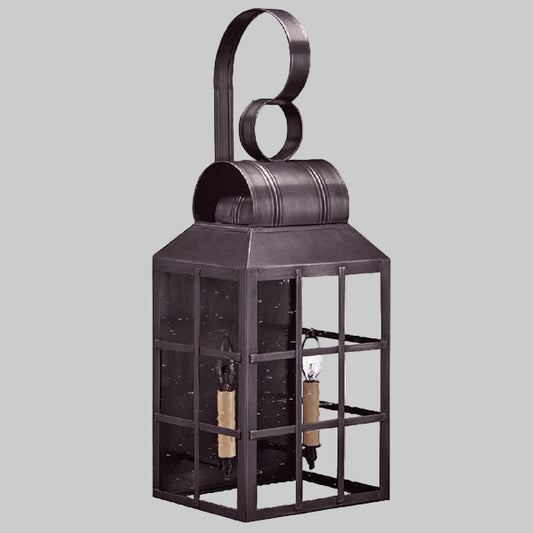 Decorative metal lantern with glass panels on a gray background