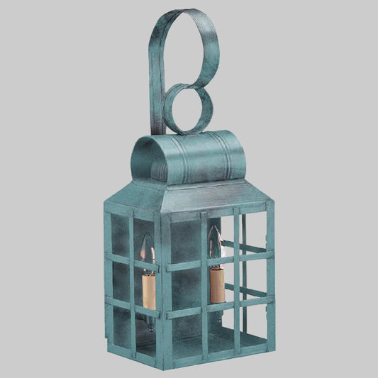 Teal metal lantern with a circular handle on a white background