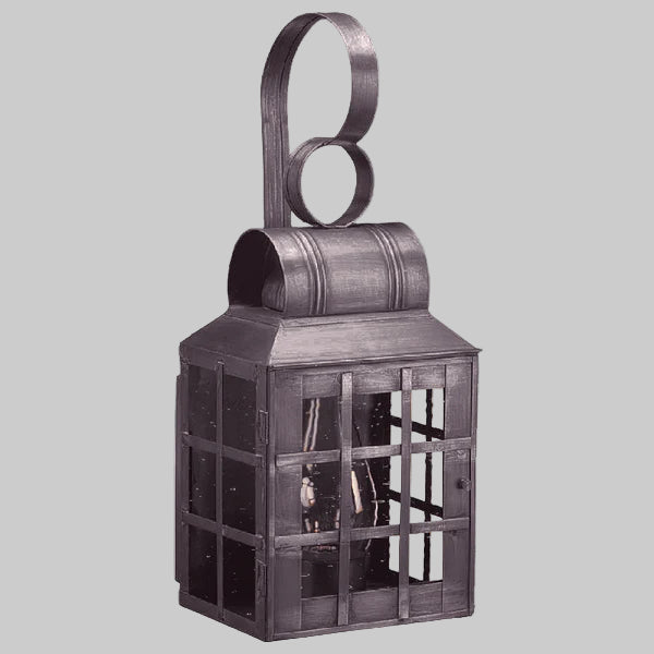 Decorative metal lantern with a handle on a gray background