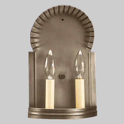 Bronze wall sconce with two candle-style lights on a gray background