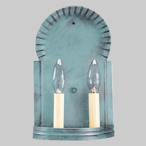 Teal wall sconce with two candle-style light bulbs on a gray background