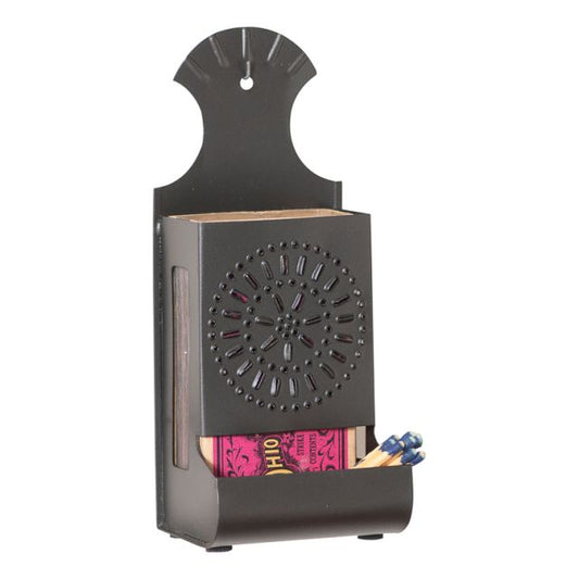 A smokey black metal match box with a solid pattern, featuring a circular design on the top and a compartment for matches at the bottom.