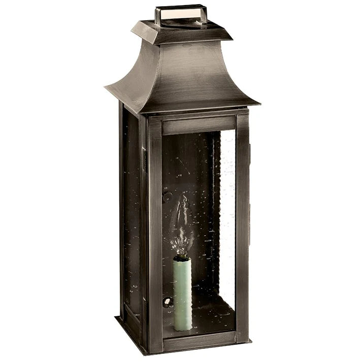 Decorative outdoor lantern with a candle inside on a white background