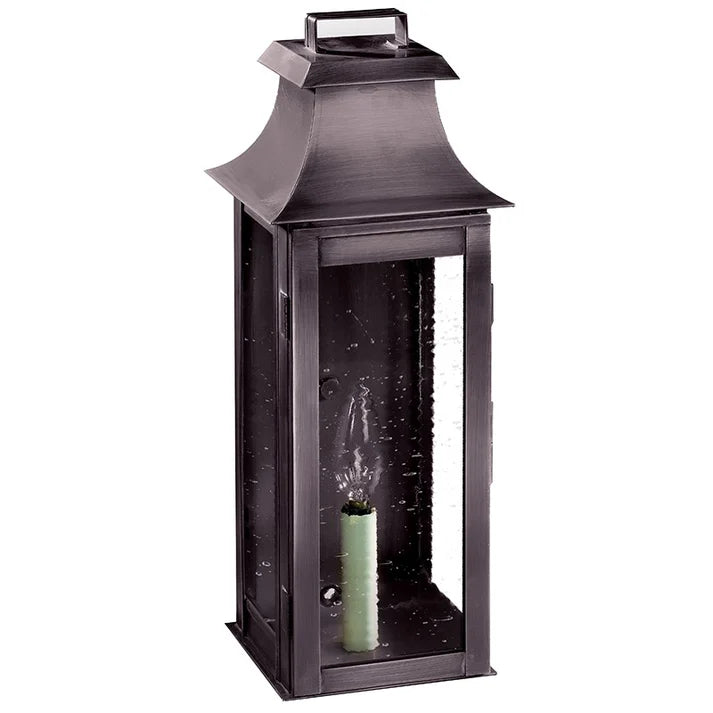 Black lantern with a candle inside on a white background