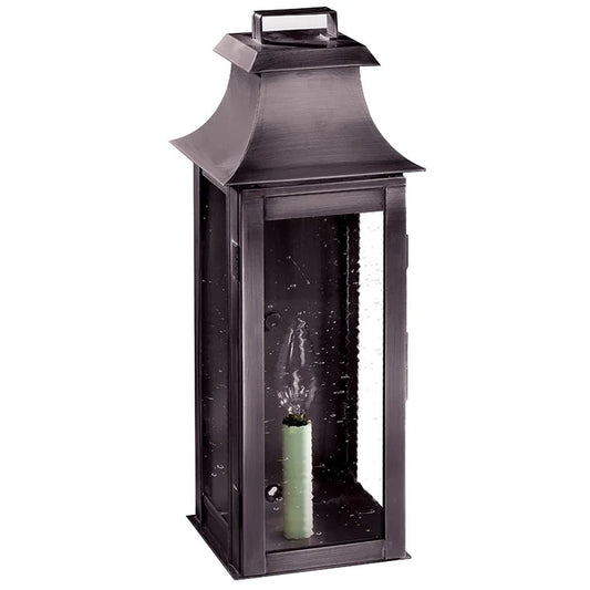 Black lantern with a candle inside on a white background