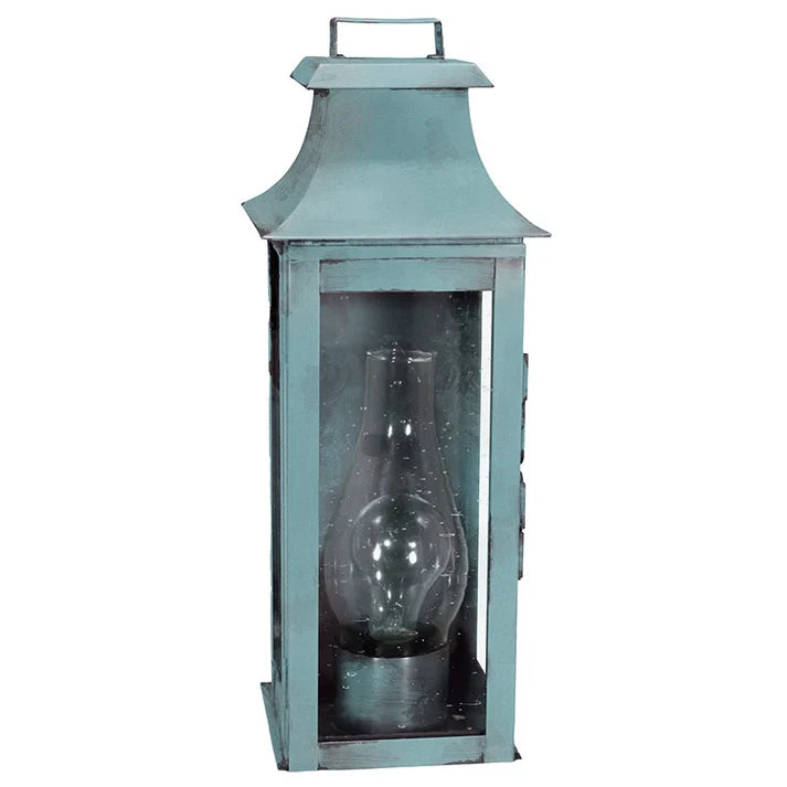 Vintage-style teal lantern with a clear glass insert on a white background