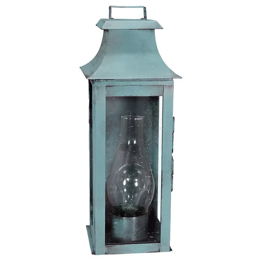 Vintage-style teal lantern with a clear glass insert on a white background