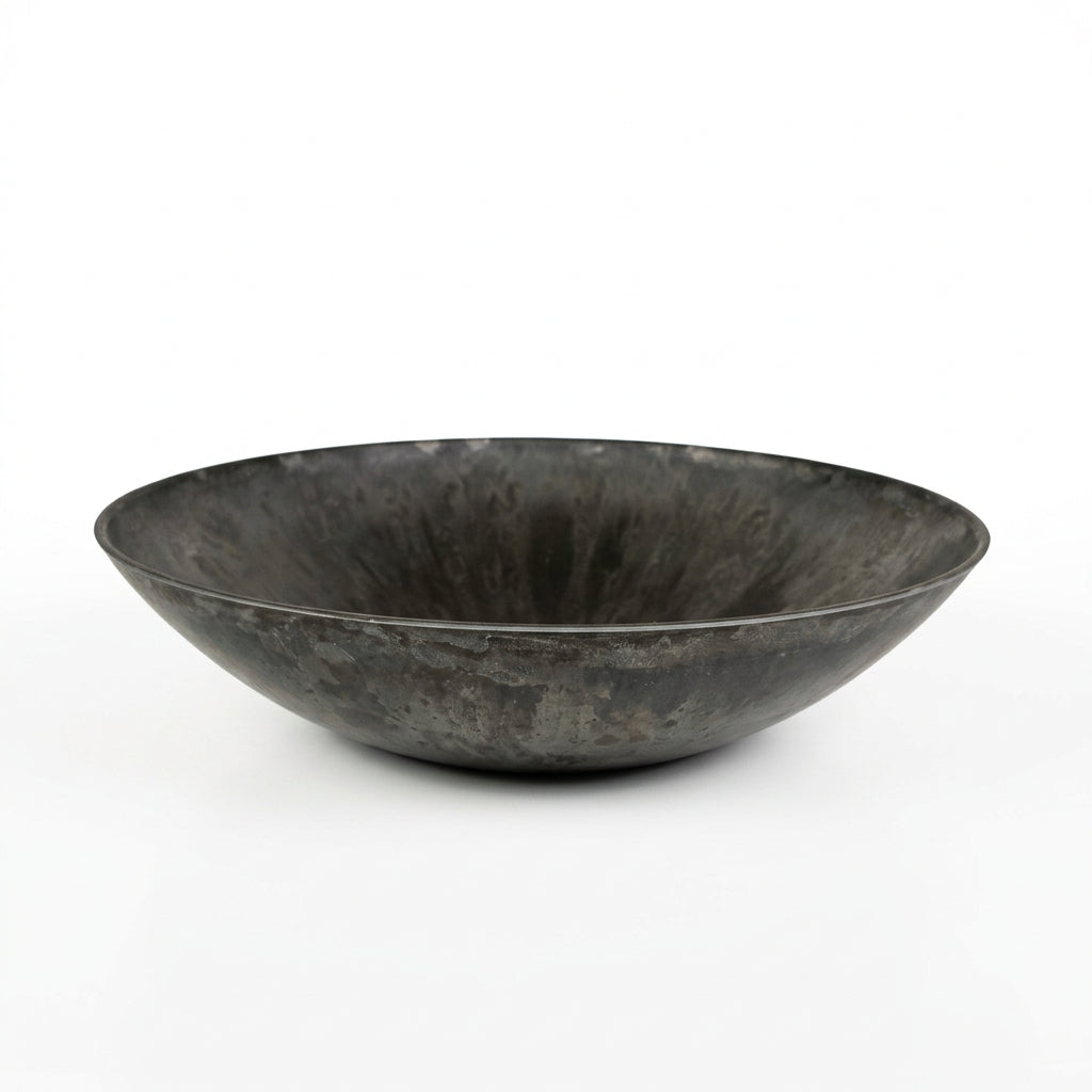 Black plastic bowl on a white background.