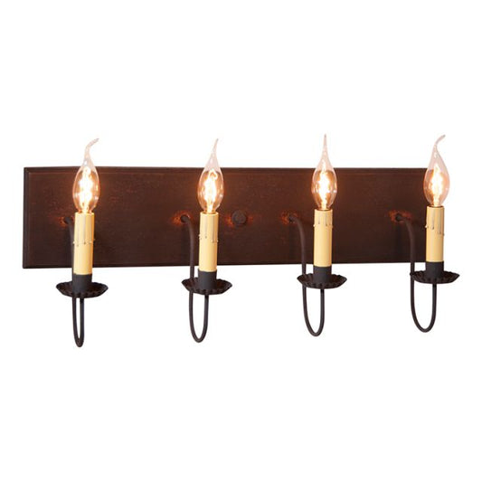 A four-light vanity light fixture with a black over red finish, featuring textured arms with crimped pans and E12/Candelabra sockets.