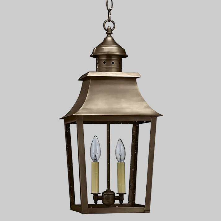 Bronze hanging lantern with two candle-like lights on a white background
